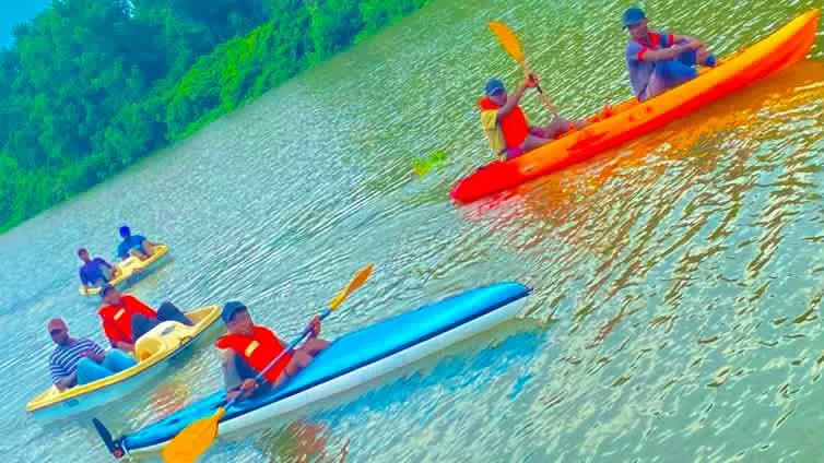 Guests kayaking together on the Kwanza River